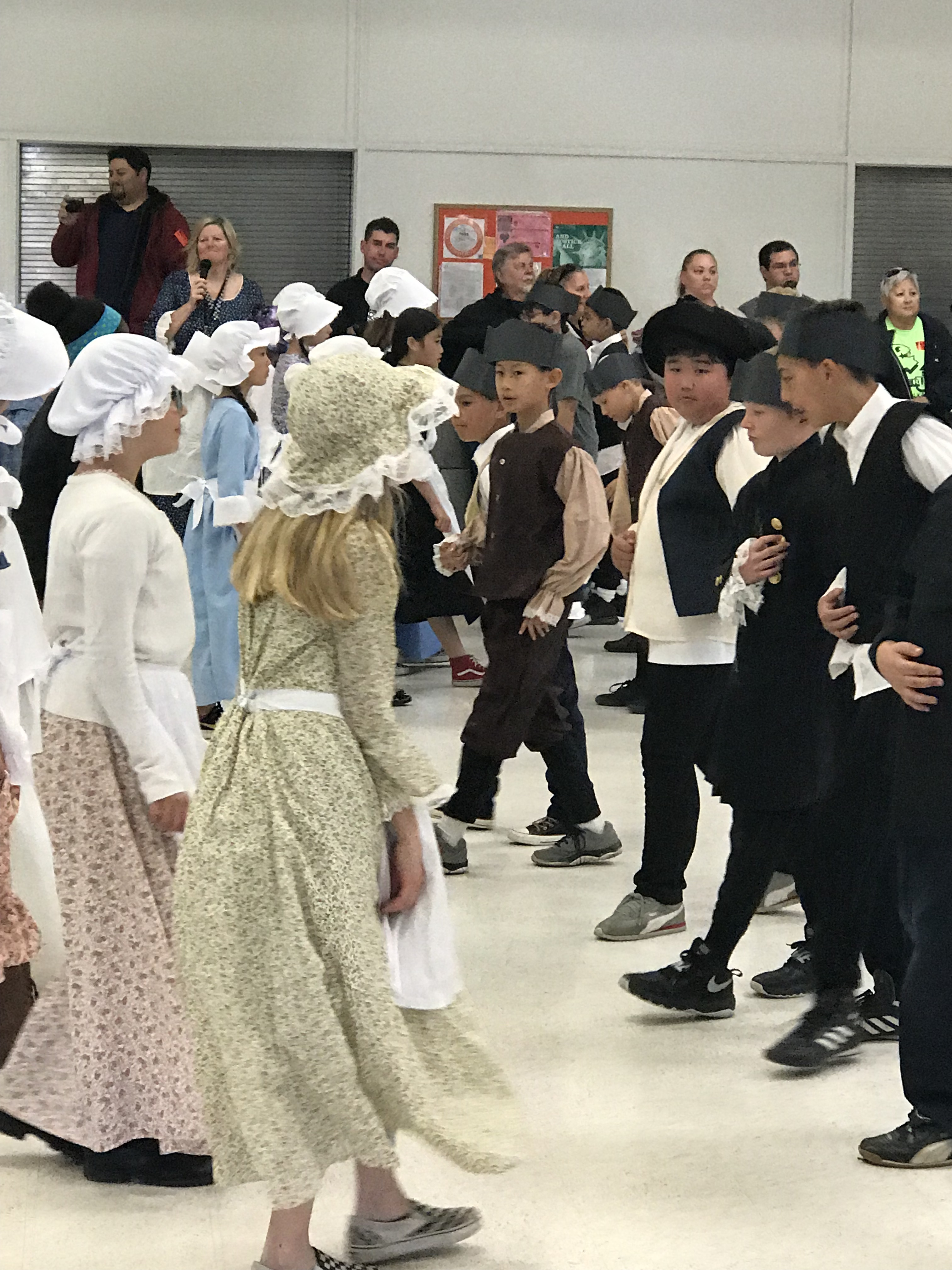 During Colonial Day, the fifth grade students learn a variety of dances which they perform for the parents.