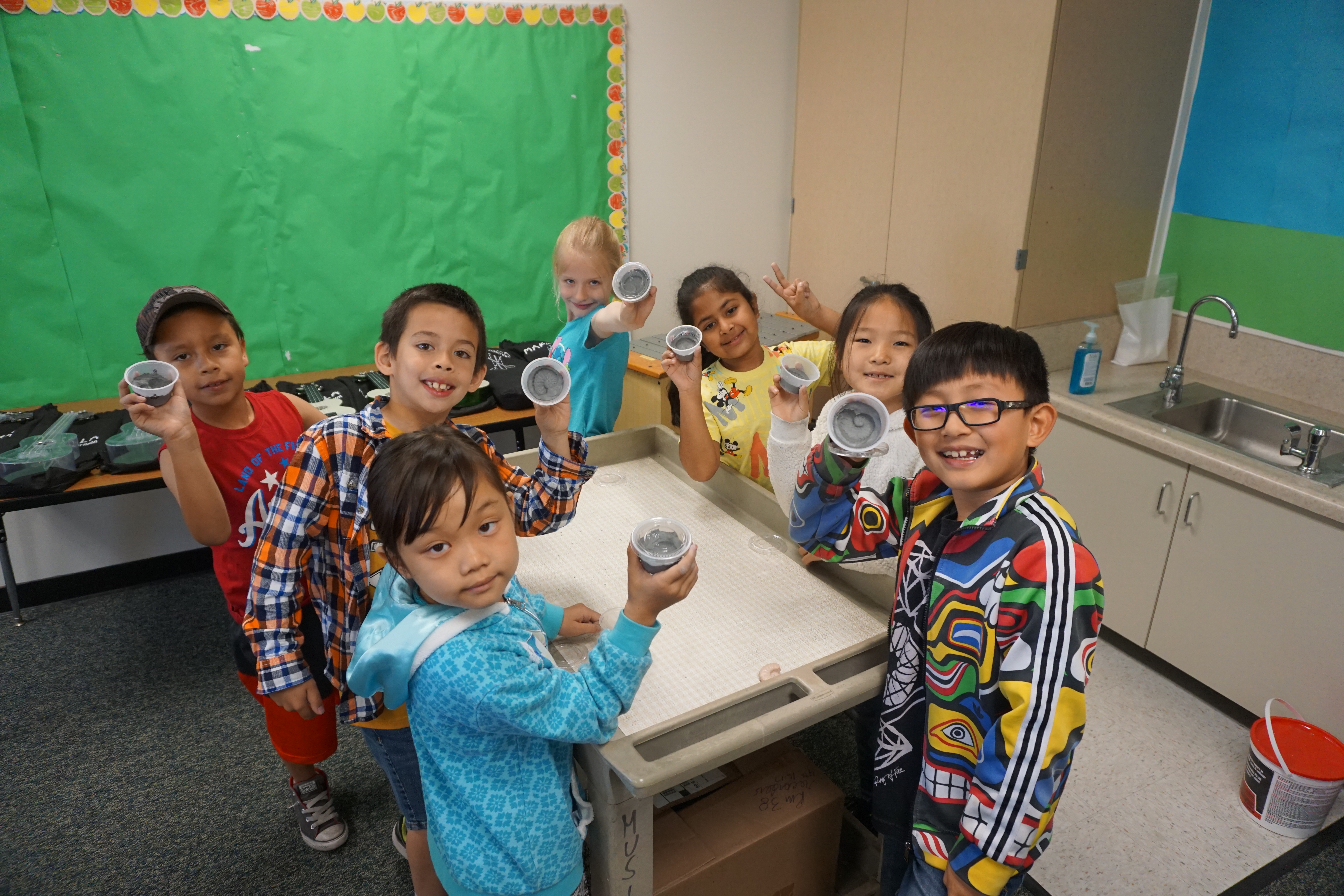 These students show off their own fossil creations!