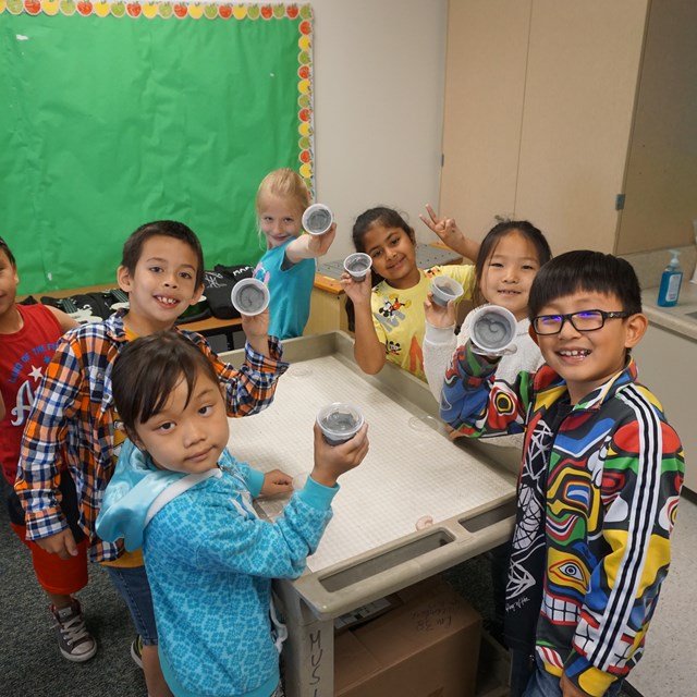 These students show off their own fossil creations!