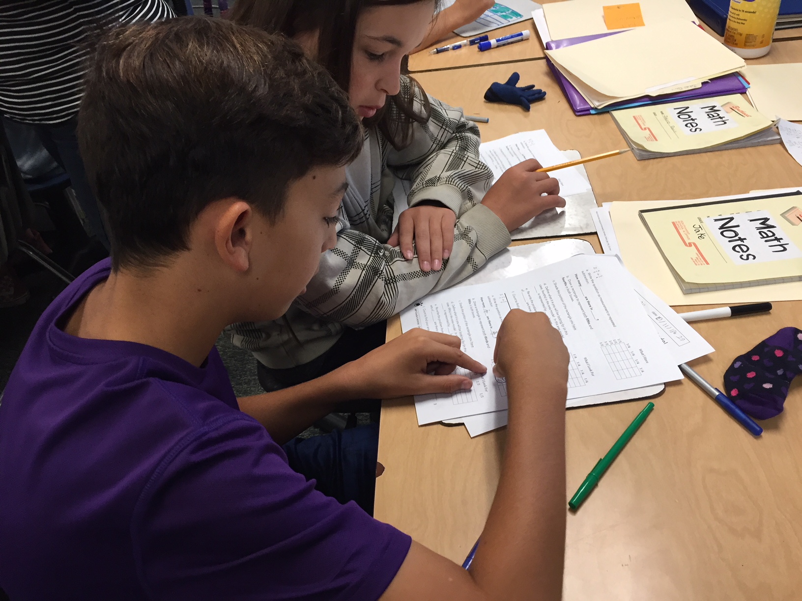 6th Graders work through math concepts together